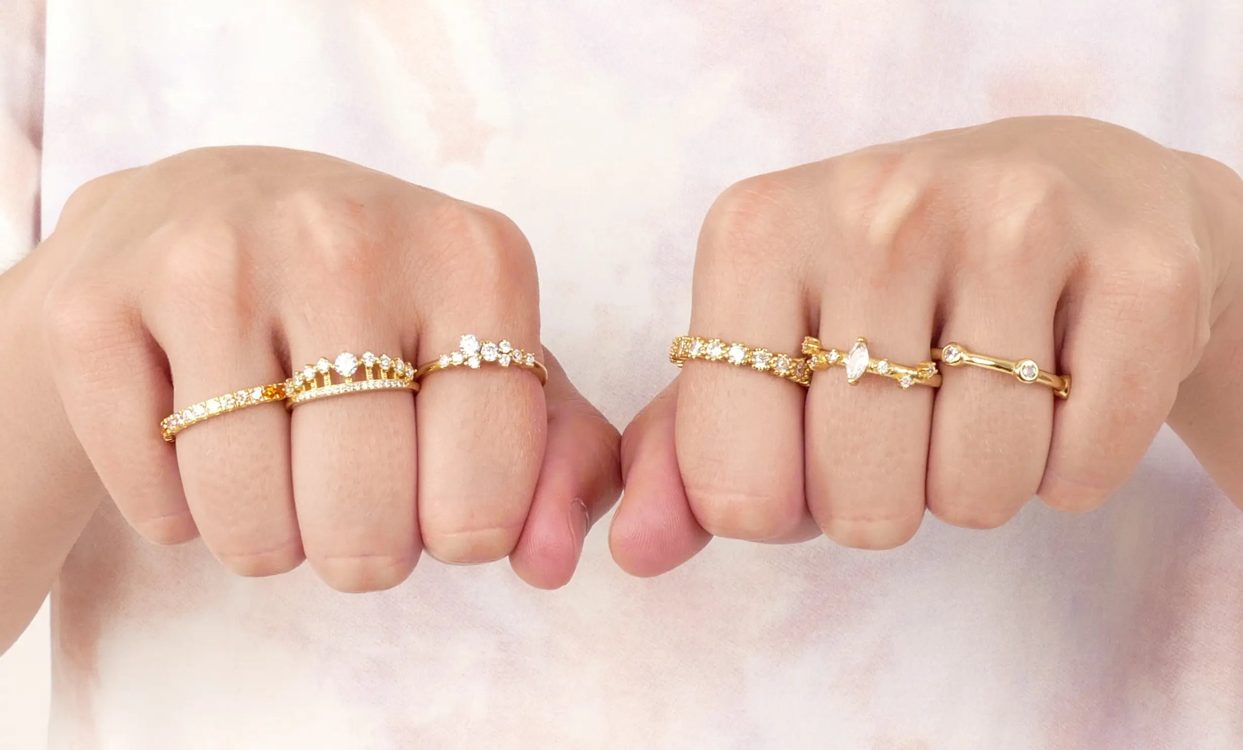 Women wearing gold silver diamond rings 