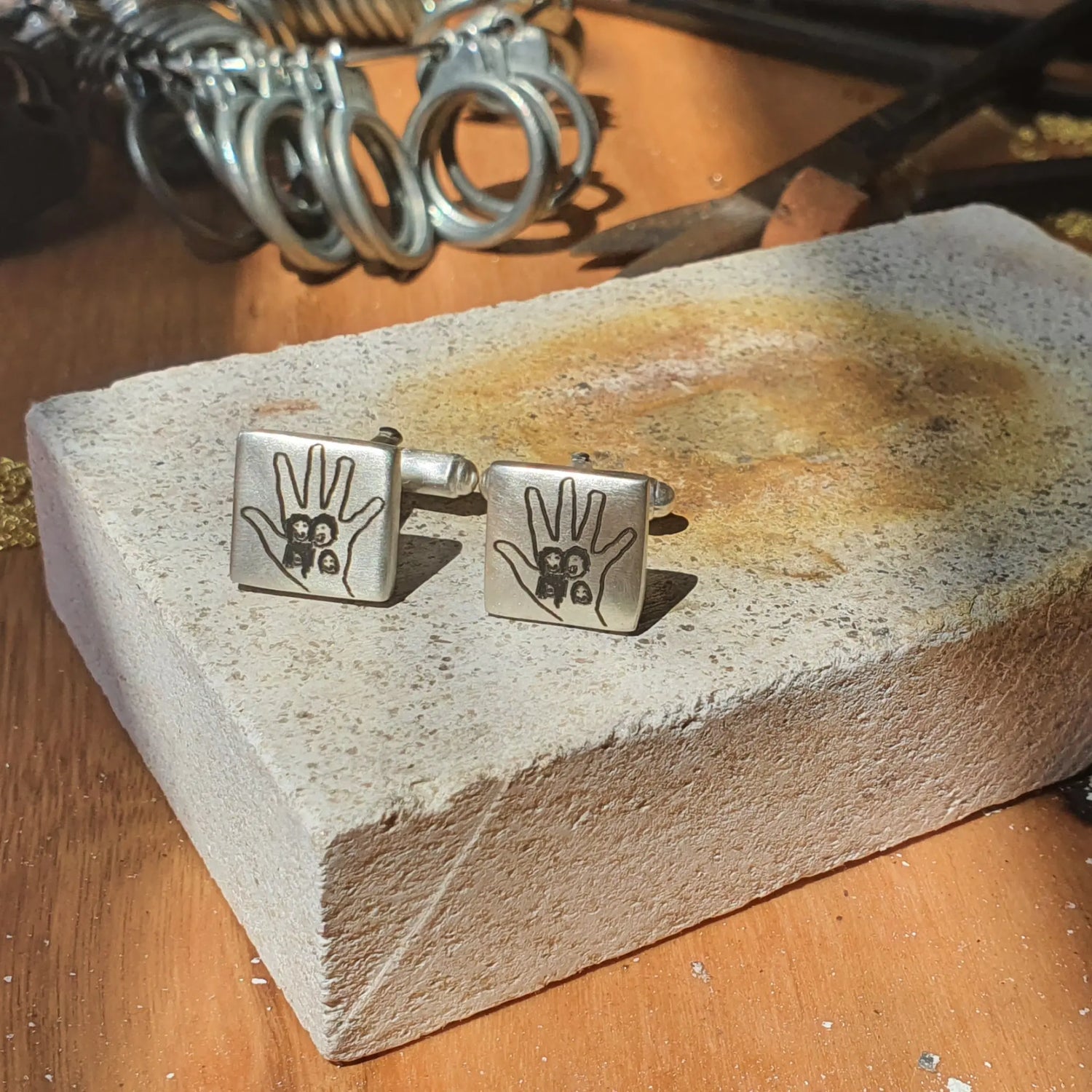 Jewellers workshop with custom silver engraved cufflinks